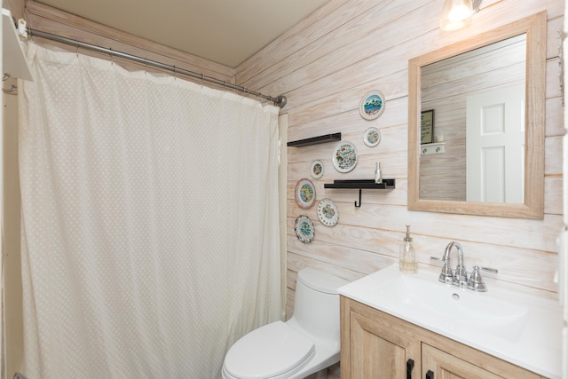 6698 Nassau St, Saint Augustine, FL 32080 - full bathroom featuring vanity, wooden walls, and curtained shower