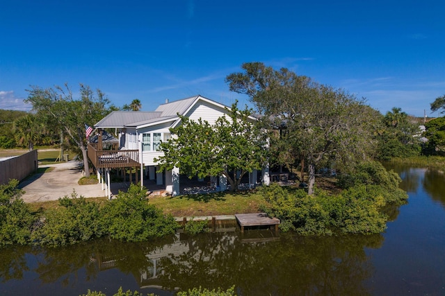6698 Nassau St, Saint Augustine, FL 32080 - rear view of property with a metal roof and a deck with water view