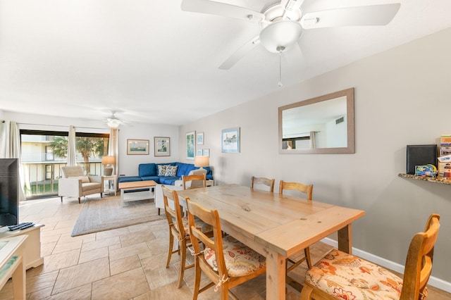 dining space featuring ceiling fan