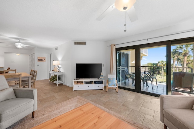 living room featuring ceiling fan