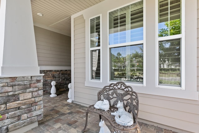 exterior space with stone siding