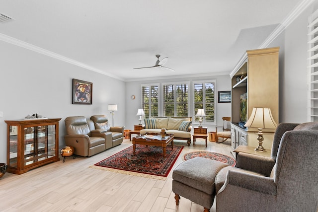 living area with crown molding, ceiling fan, light wood-type flooring, and visible vents
