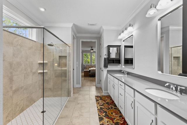 ensuite bathroom with visible vents, a sink, a stall shower, and double vanity