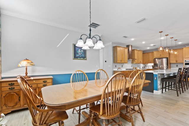 dining space featuring ornamental molding, recessed lighting, a chandelier, and visible vents
