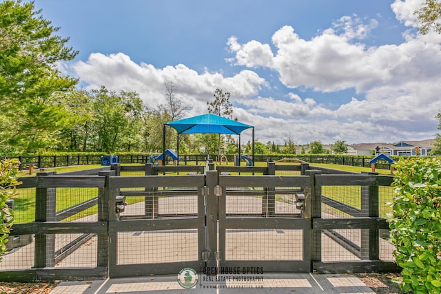 view of gate featuring fence