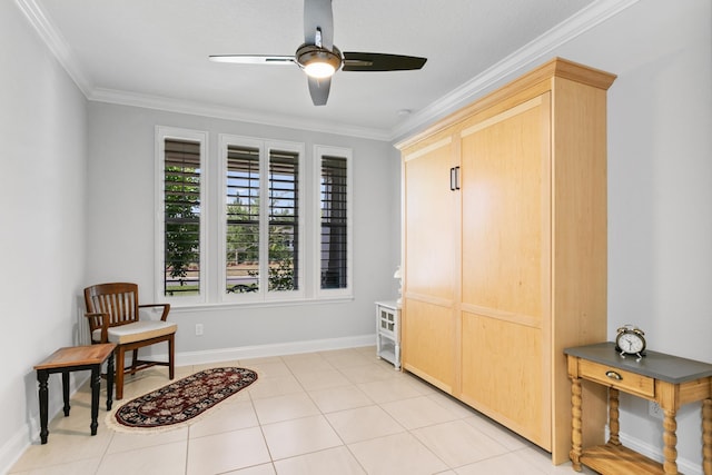 living area featuring crown molding, baseboards, ceiling fan, and light tile patterned floors