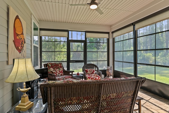 sunroom with a ceiling fan