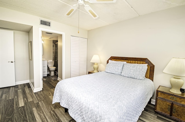 bedroom featuring ceiling fan, a closet, ensuite bathroom, and dark hardwood / wood-style floors