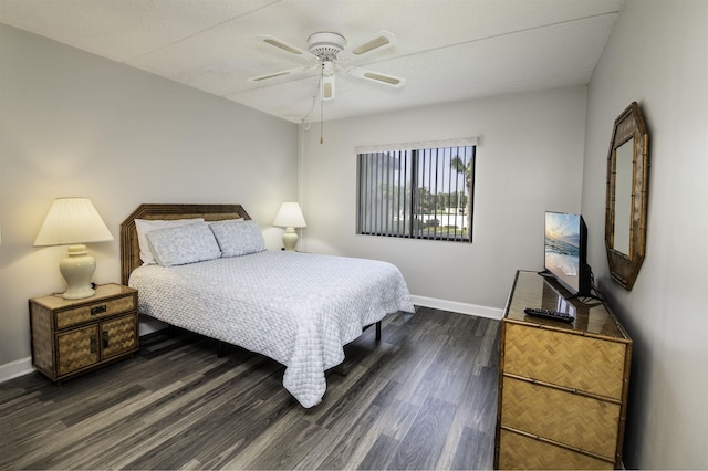 bedroom featuring ceiling fan and dark hardwood / wood-style floors