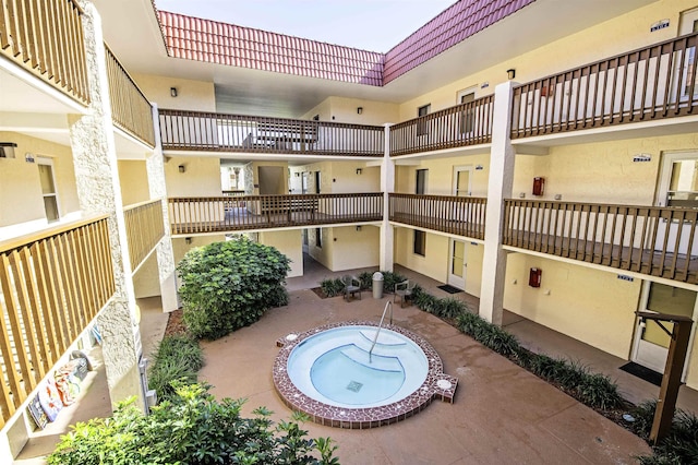 exterior space featuring a patio and a hot tub