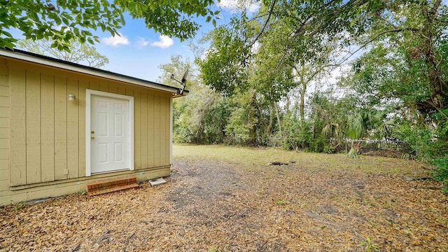 view of yard with an outdoor structure and fence