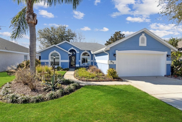 ranch-style house with a garage and a front yard