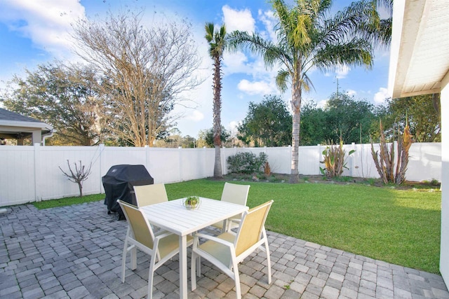 view of patio / terrace featuring a grill and outdoor dining area