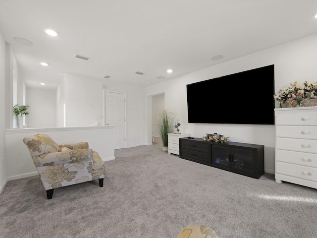 living area with light colored carpet