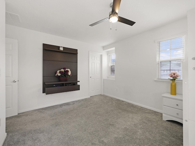 unfurnished bedroom featuring carpet flooring and ceiling fan