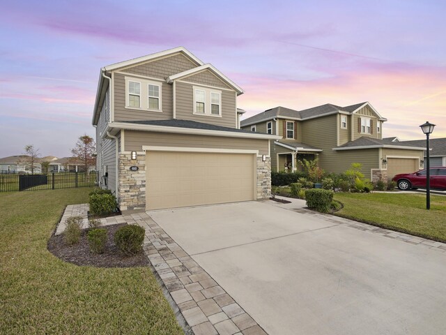 view of front facade featuring a yard and a garage