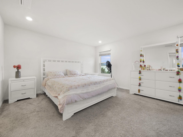 bedroom featuring light carpet