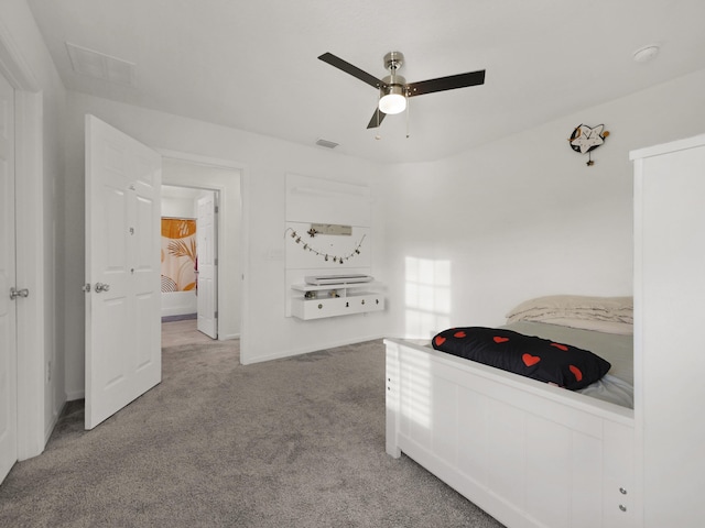 carpeted bedroom with ceiling fan