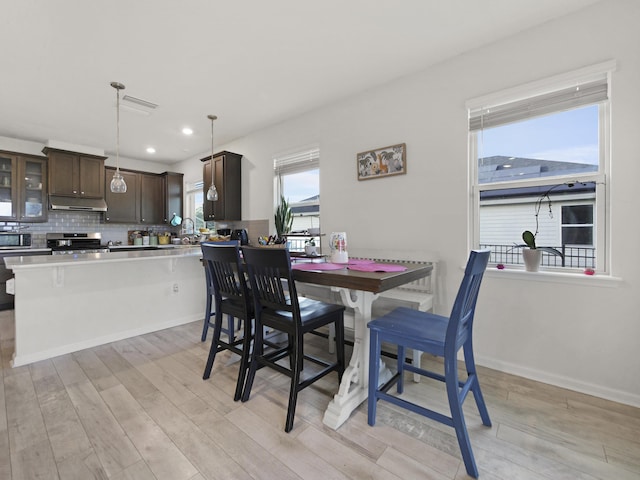 dining room with light wood-type flooring