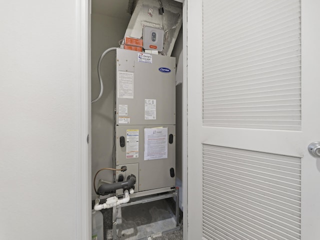 utility room with heating unit