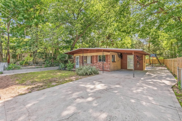 view of front of home featuring a carport