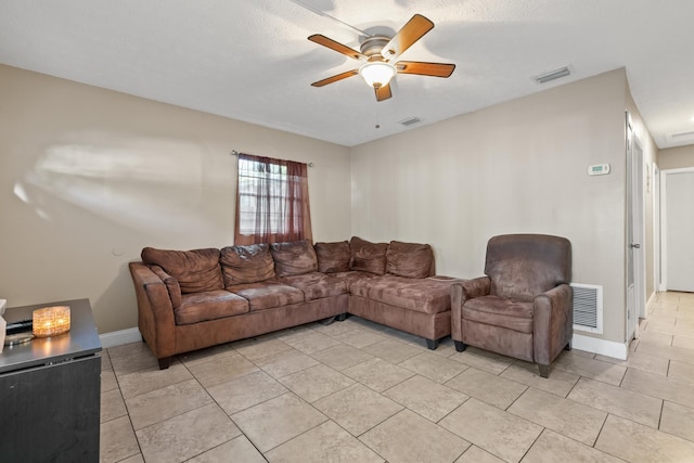 living room featuring ceiling fan and light tile patterned floors