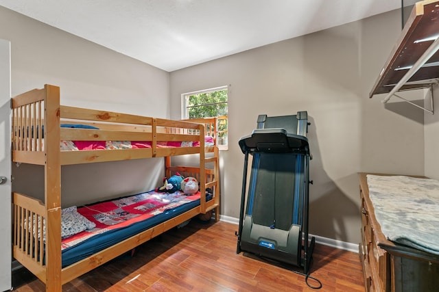 bedroom with hardwood / wood-style floors