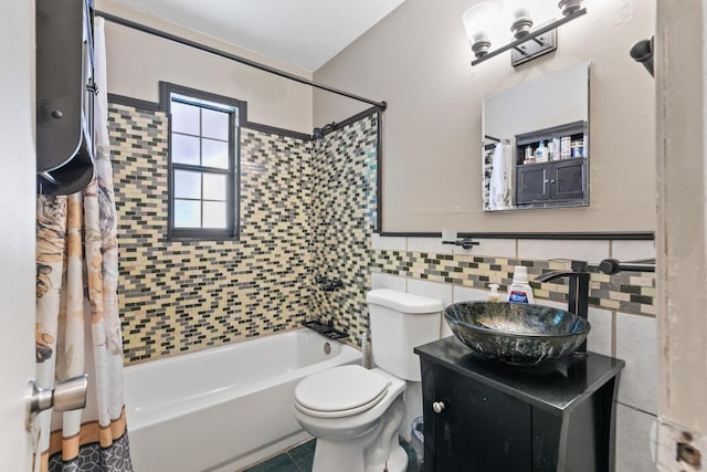 full bathroom featuring tile patterned flooring, vanity, shower / bath combination with curtain, tile walls, and toilet