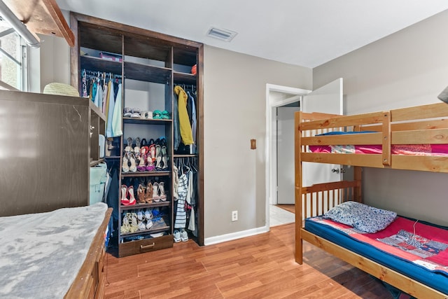 bedroom with light hardwood / wood-style floors