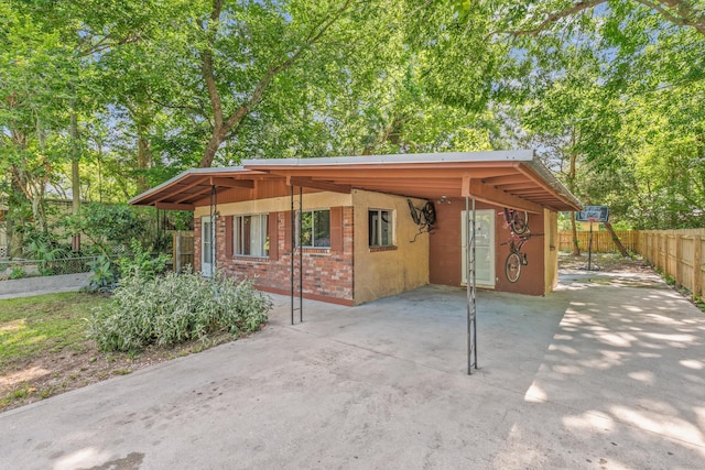 exterior space featuring a carport