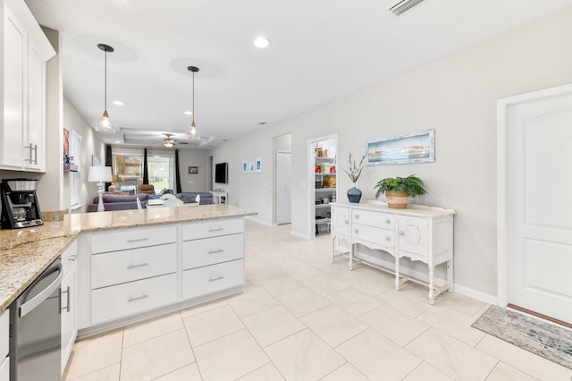 kitchen featuring light stone counters, stainless steel dishwasher, open floor plan, a peninsula, and white cabinets