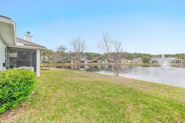 view of yard with a water view