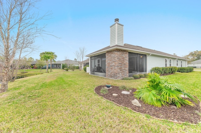 view of yard featuring a sunroom