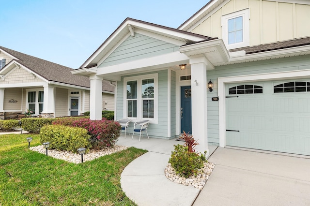 doorway to property with a garage, board and batten siding, and a porch