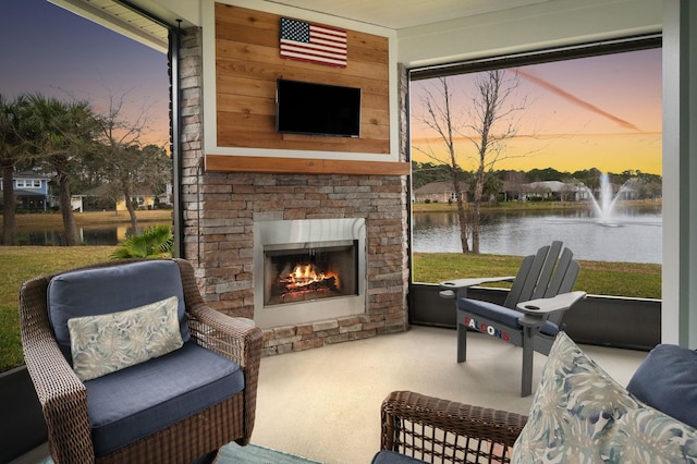 view of patio featuring a lit fireplace