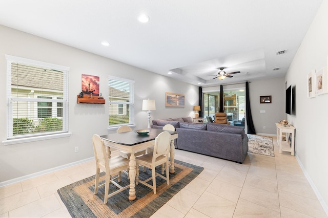 dining area with light tile patterned flooring, recessed lighting, plenty of natural light, and baseboards