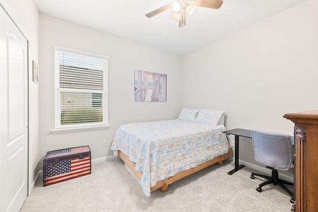 bedroom with baseboards, carpet, and a ceiling fan