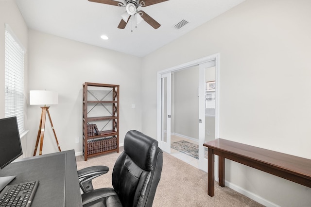 carpeted office space featuring recessed lighting, visible vents, baseboards, and ceiling fan