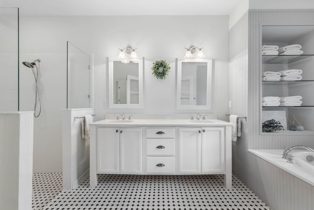 19 Smiling Fish Ln, Palm Coast, FL 32137 - full bath featuring a garden tub, walk in shower, and double vanity