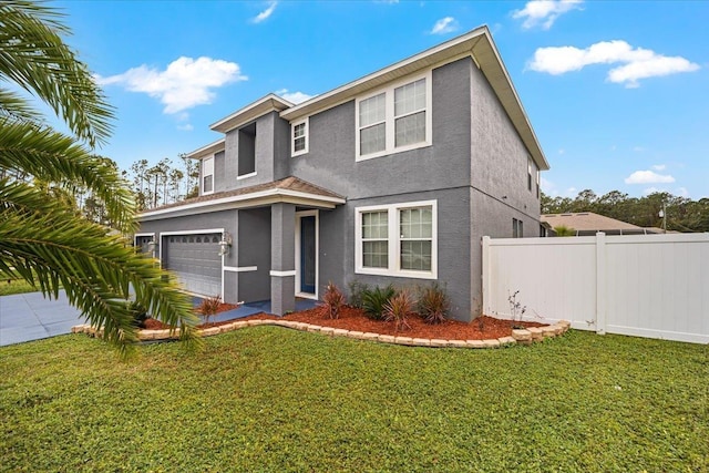 view of front facade featuring a garage and a front lawn