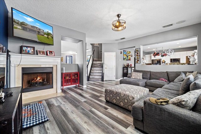 living room featuring hardwood / wood-style floors and a textured ceiling