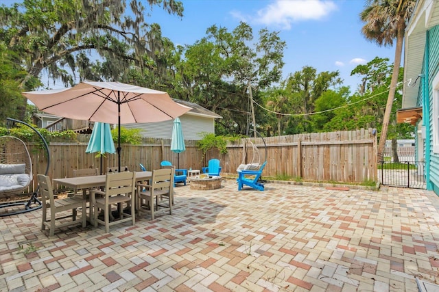 13 Douglas Ave, Saint Augustine, FL 32084 - view of patio / terrace with a fire pit and outdoor dining area