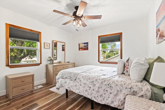 13 Douglas Ave, Saint Augustine, FL 32084 - bedroom featuring multiple windows, wood finished floors, and baseboards