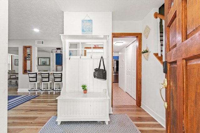 13 Douglas Ave, Saint Augustine, FL 32084 - entrance foyer with light wood-style flooring, baseboards, and stairs