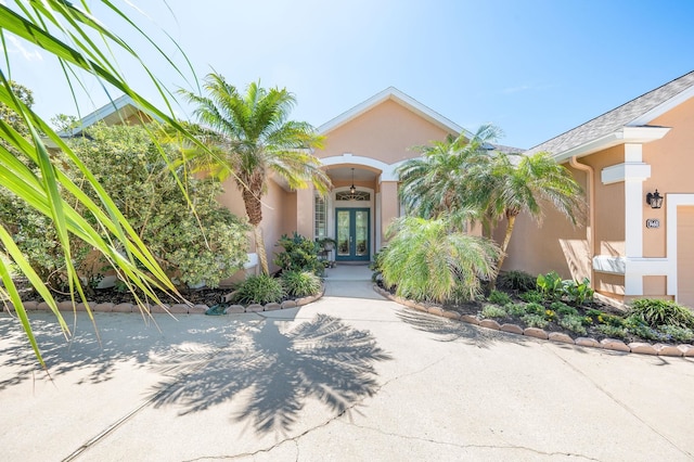 view of front of property featuring french doors and stucco siding