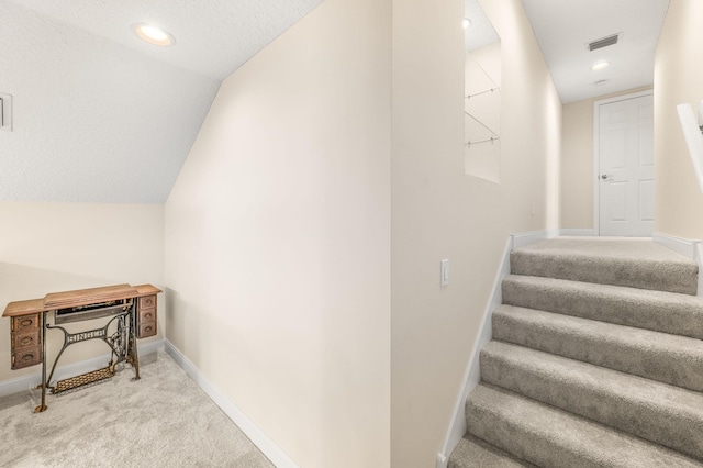 stairway with baseboards, carpet flooring, recessed lighting, and visible vents