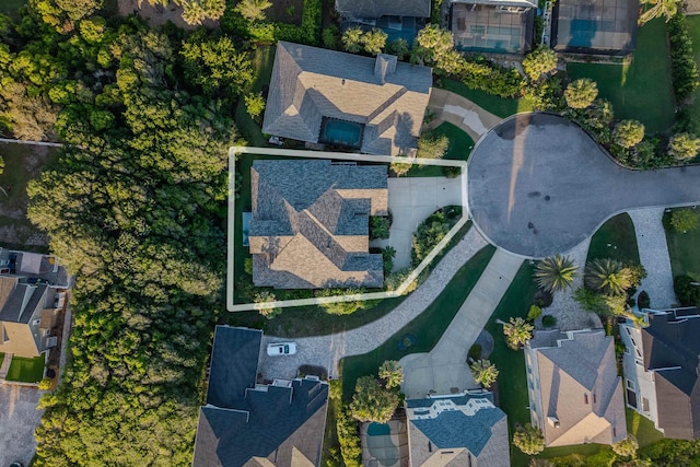 birds eye view of property with a residential view