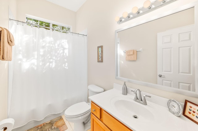 bathroom with vanity, shower / tub combo, and toilet