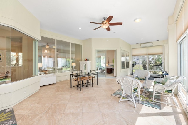 sunroom with recessed lighting, ceiling fan, and tile patterned floors