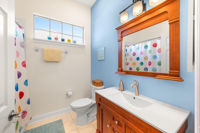 full bathroom with tile patterned flooring, curtained shower, vanity, baseboards, and toilet